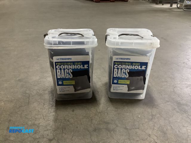 Lot 2-23099 - Lot of (2) sets of triumph professional grade black/gray cornhole bags