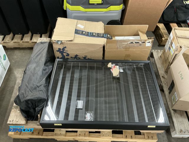 Lot 2-18765 - Skid lot includes: elliptical trainer, white plastic storage containers, roll up camping table, and ...