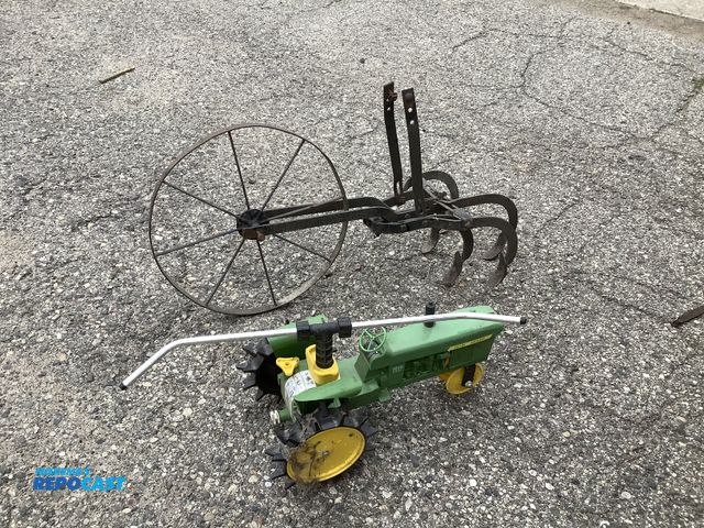 Lot 2-35009 - Rotating Traveler Lawn Sprinkler, and vintage walk behind garden cultivator