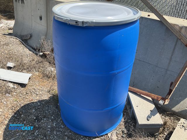 Lot 2-99354 - 55 gallon blue plastic barrel w/ removable &amp; locking ring - contained a food product