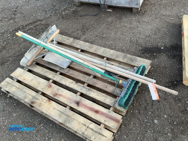 Lot 2-40663 - Lot of used hand tools including two brooms, metal rake, concrete come a long, and short handle shov...