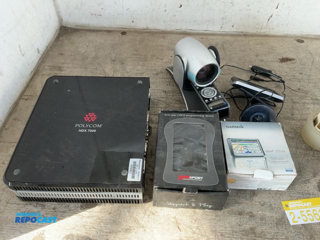 Lot 2-55617 - Lot of assorted electronics including: a Garmin, Polycom HDX 7000 video conference system and more. ...