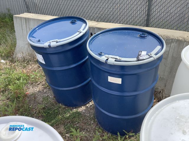 Lot 2-15588 - lot of 2 55 gallon blue steel barrels with removable lids and locking rings, clean inside, contained...