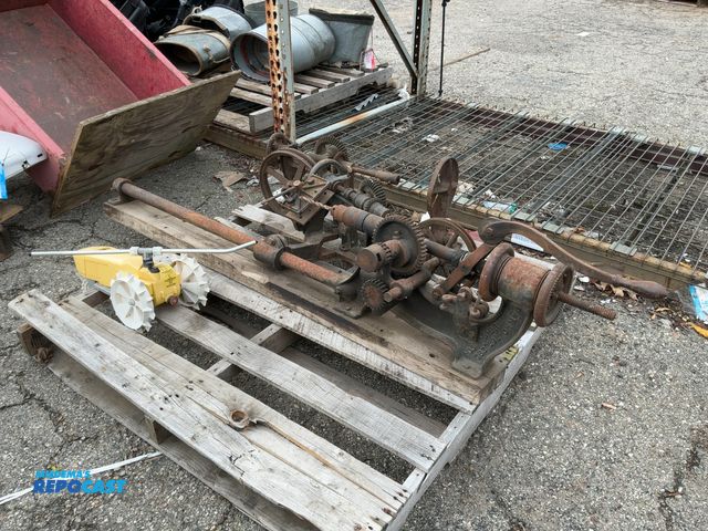 Lot 2-69294 - Lot of vintage cast iron hand crank post drill presses and a yellow tractor yard sprinkler
