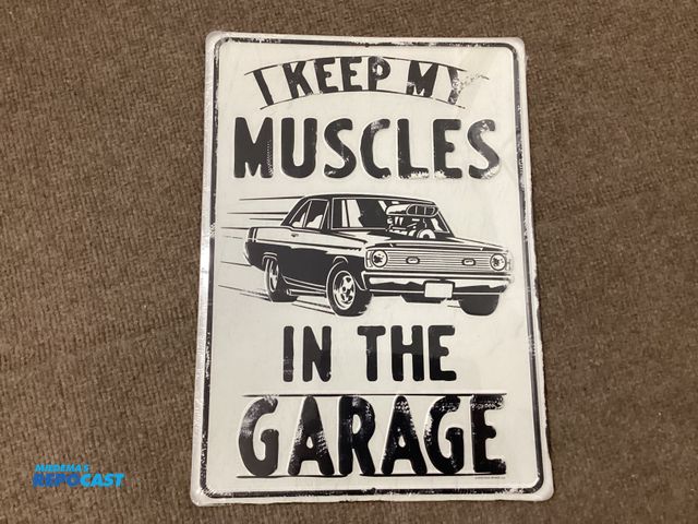 Lot 2-77714 - New vintage looking metal sign by Open Road. I keep my muscles in the garage. Measures 10” X 14”
