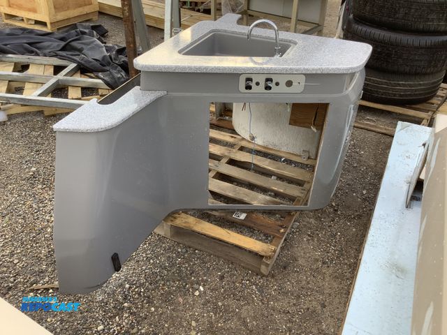 Lot 2-35561 - Lot of (1) kitchen area pontoon center console with sink cup holders a compartment storage door and ...