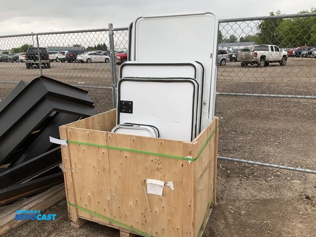 Lot 2-92473 - crate of misc.sized white rv cargo doors