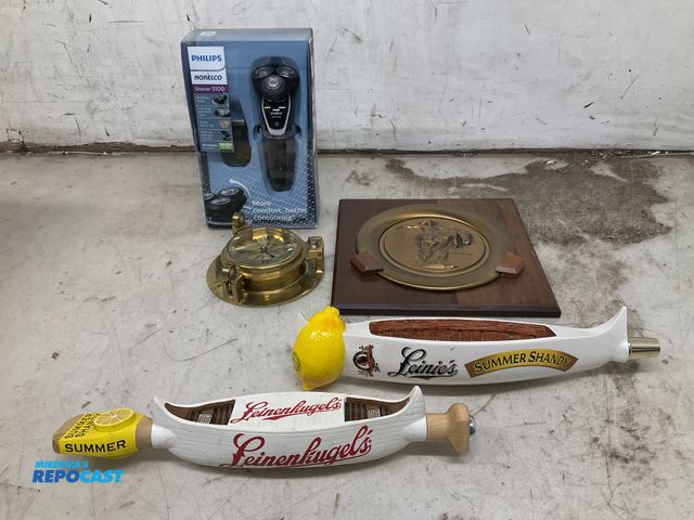 Lot 2-35573 - (1) Kederick Remington plack (1) oceanic quartz clock (2) leinenkugels summer shady (1) Philips nore...