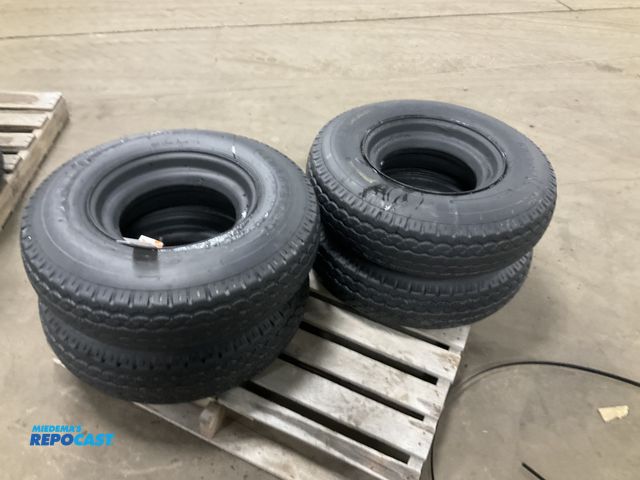 Lot 2-42677 - (4) 8-14.5 tires on steel mobile home style wheels, used