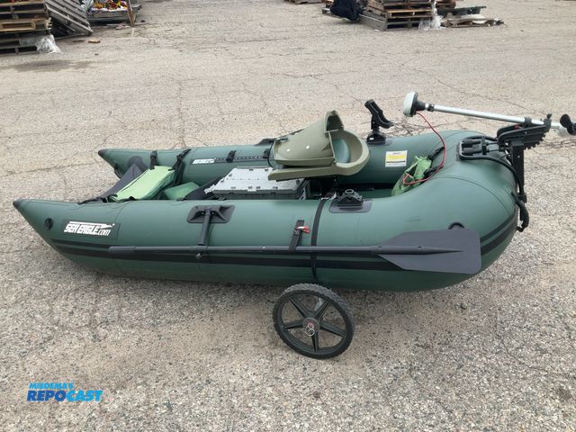 Lot 2-33613 - Sea eagle 1 person blow up boat with a water snake electric motor and 2 paddles