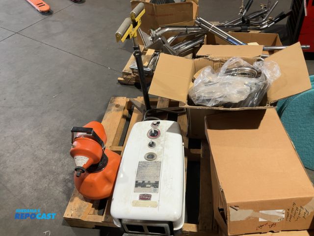 Lot 2-33049 - Skid lot of miscellaneous items including Paloma gas water heater 2 ford mirrors 4 rims for tires a ...