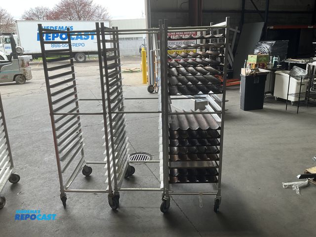 Lot 2-55142 - Lot of (3) John Boos 20.5” width x 69” height x 26” depth aluminum bread racks with (14) baguette tr...