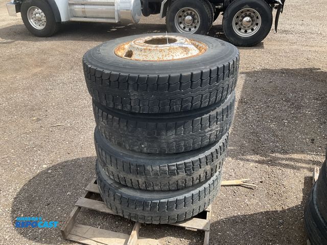 Lot 2-11834 - (4) recap 275/80R22.5 semi tires on steel wheels, used