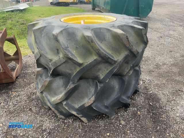 Lot 2-21272 - (2) Used 23.1-26 Tires on Steel 8-lug Wheels, approx. 8-3/4” center hole, both are flat, top is miss...