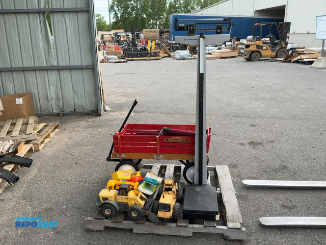 Lot 2-75057 - Skid lot of health-o-meter scale, tonka trucks, little tikes truck, radio flyer wooden wagon, centra...