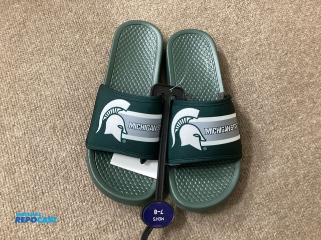 Lot 2-11077 - New Michigan State Spartans slides by FOCO. Officially licensed collegiate products. Men’s size 7-8
