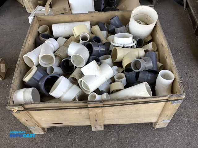 Lot 2-69067 - Small wooden crate of assorted size, shape, and color pvc fittings