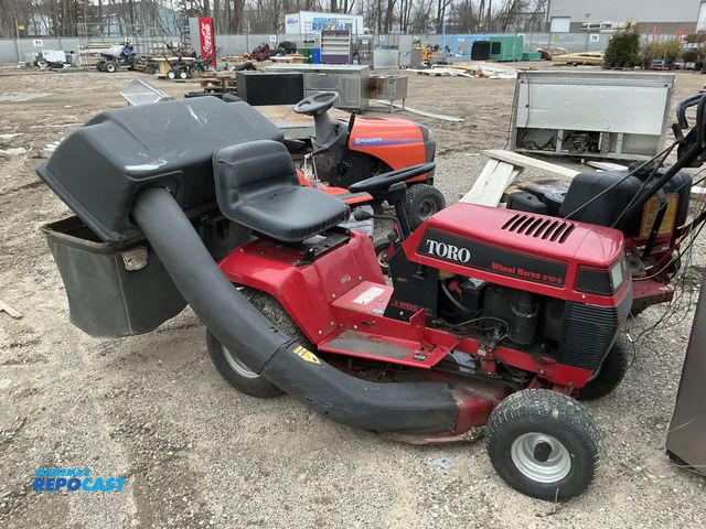 Lot 2-40543 - Toro 3210B504 Riding Lawn Mower (1) red toro lawn mower/tractor missing some parts but can use has l...