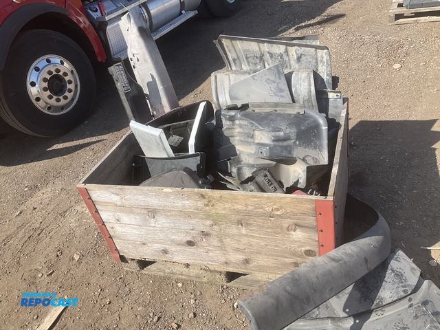 Lot 2-11745 - Crate of misc truck parts including inner fenders, corner fairings, and some brackets, used
