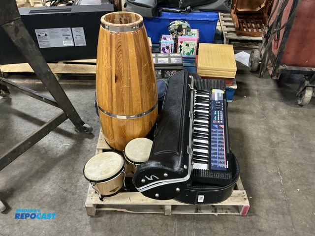 Lot 2-11120 - Skid of Musical Instruments including acoustic guitar, bongo drum, trombone, saxophone, keyboard