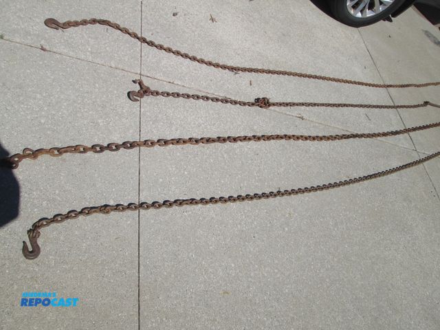 Lot 2-59063 - 4pcs of logging chain - (2) 20' pcs and (2) 13' pcs - link are 2" &amp; 2-1/2"