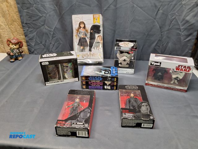 Lot 2-10668 - STAR WARS VHS TAPES AND COLLECTIBLES.