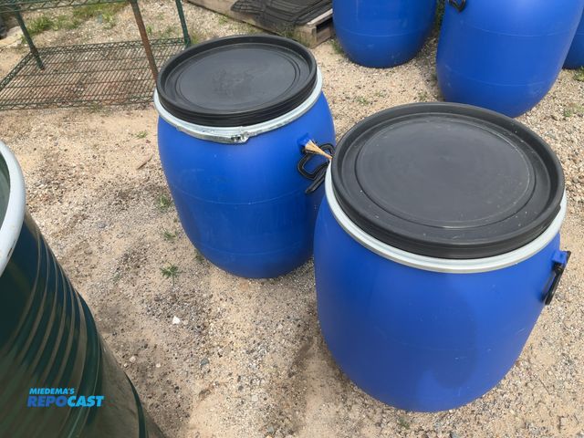Lot 2-82 - (2) 25 gal blue plastic barrels with removable lid and locking rings - clean inside