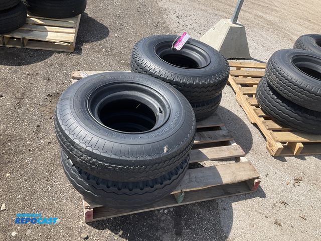 Lot 2-22325 - (4) 8-14.5 tires on steel mobile home style wheels, used