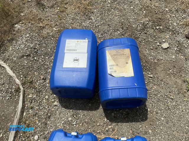 Lot 2-64038 - lot of 2 6 gallon blue plastic containers, contained fruit juice