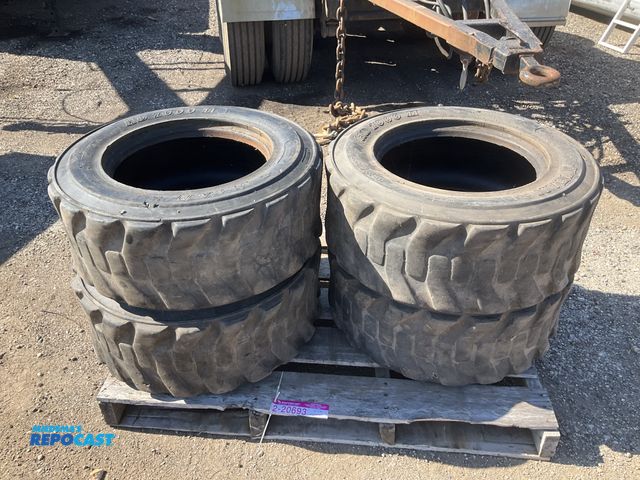 Lot 2-20693 - (4) 10-16.5 skid steer tires, used