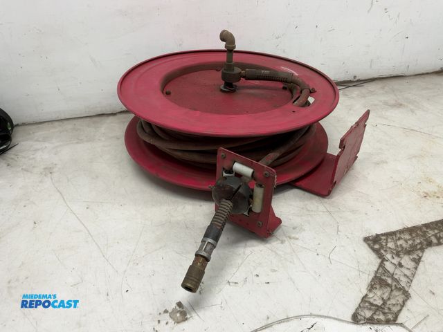 Lot 2-69594 - Industrial red spring loaded hose reel