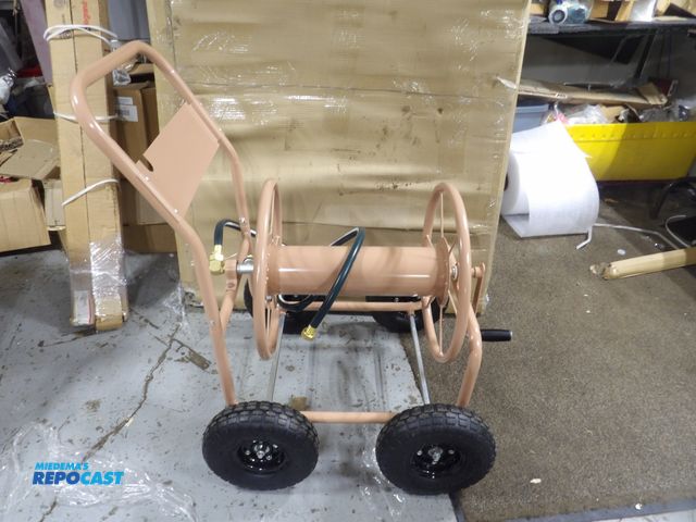Lot 2-53898 - New Liberty Garden hose reel Cart,
35" H x 33-3/8" Lx 24-1/2" W. includes 5'
leader hose, heavy-duty...
