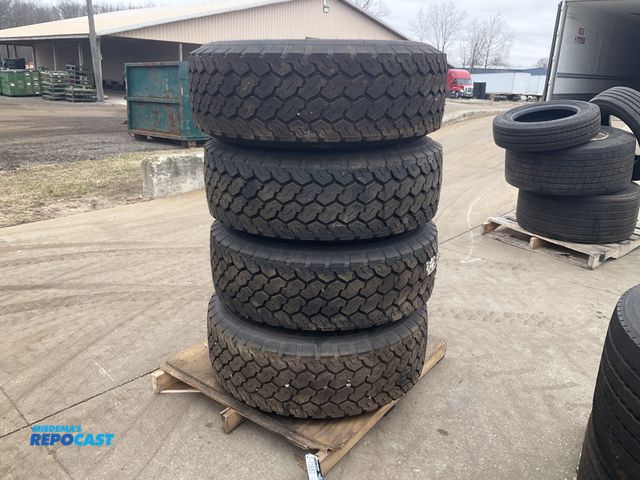 Lot 2-11580 - (4) 385/65R22.5 semi tires on steel 10-bolt wheels