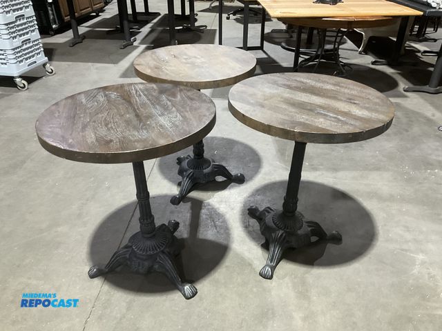 Lot 2-55147 - (6) 23” diameter by 28” height cafe tables with solid wood tops and single metal leg.  (RSSC)