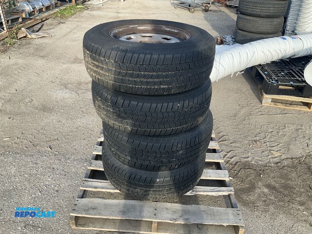 Lot 2-67077 - Set of Michelin Defender LTX m/s 235/70R16 tires with rims