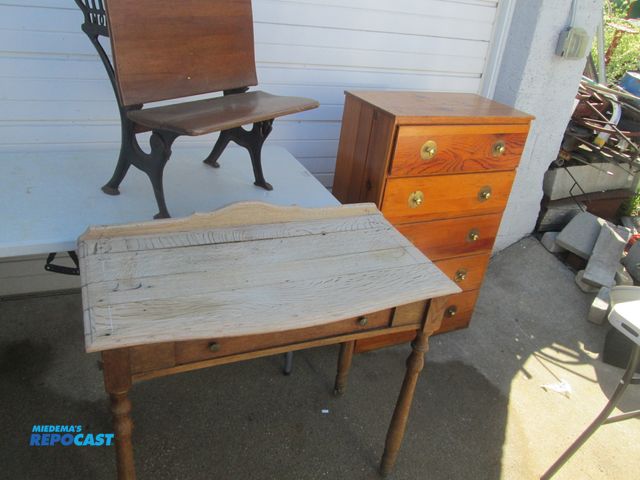 Lot 2-59151 - vintage knotty pine 5 drawer dresser, brass pulls,. oak table with a drawer 36" x 18". child's schoo...