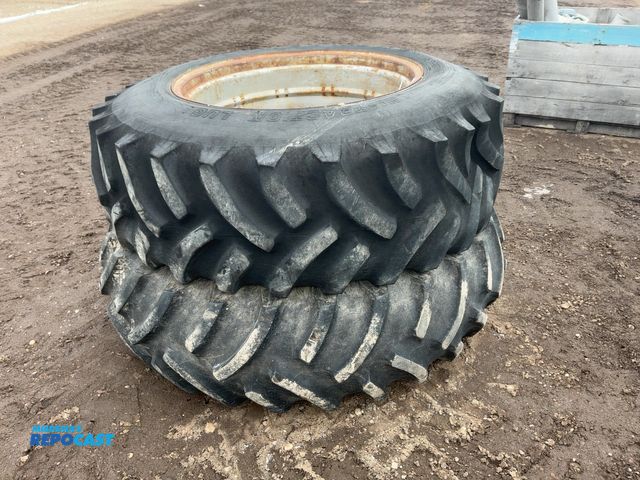 Lot 2-33577 - (2) Used Armstrong Size 18.4-34 Tires on Steel Wheels, bottom tire is filled/loaded, top tire is fla...