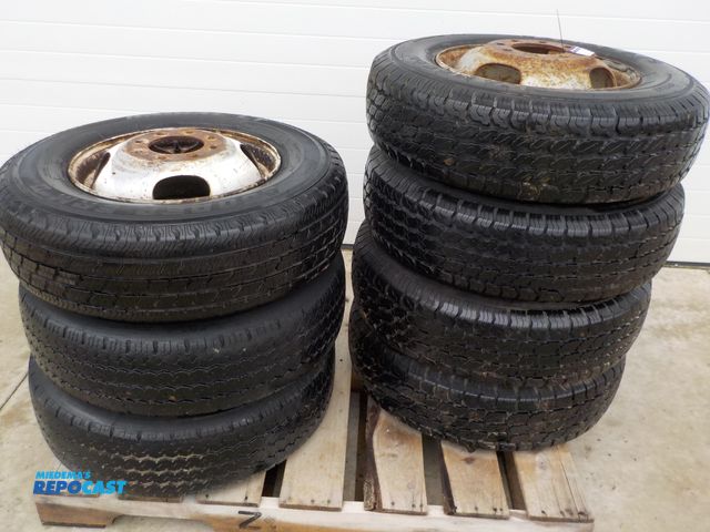 Lot 2-33549 - Lot of (7) 8.75R16.5 LT Tires on Rims, Radials, 8 Bolt Pilot Rims, four Matching, two Matching, and ...