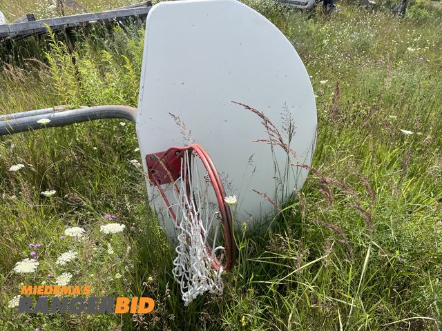 Lot 30-1169 - (1) 10' Basketball Hoop with Pole Metal, has concrete on the bottom.