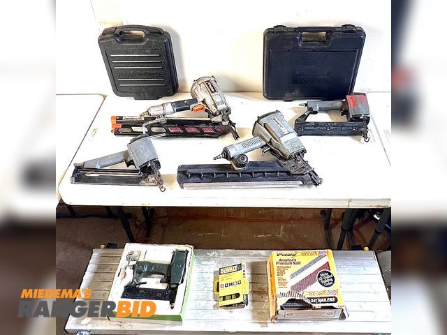 Lot 30-509 - 7 Various makes Various models Pleumatic air hammers and staplers Lot of seven (7) air nailers and staplers. Paslode, Porter Cable, Stanley Bostich, JW