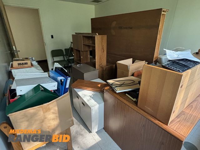 Lot 30-1205 - Miscellaneous desks, chairs, filling cabinets, computer monitor, printer, random electronics cords,  2 large oak book shelves, table. IBM electric typewriter. Buyer is responsible for removal.