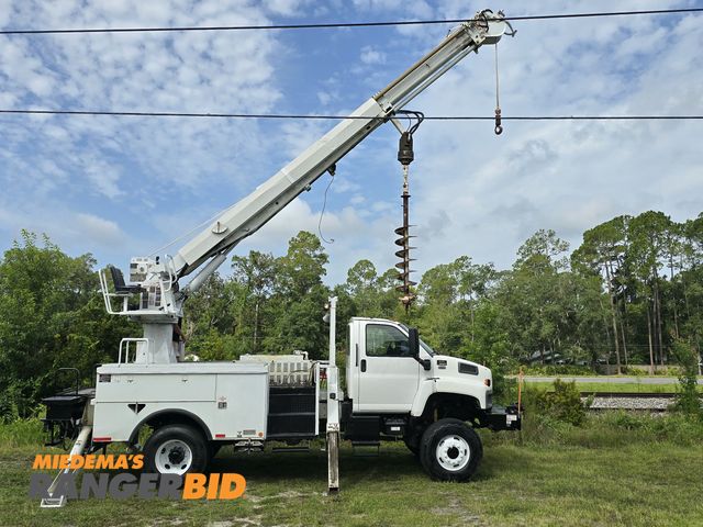 Lot 30-11303 - 2009 GMC C8500 CRANE DIGGER DERICK BOOM UTILITY TRUCK The Altec DM47-TR boom has a sheave height of ...