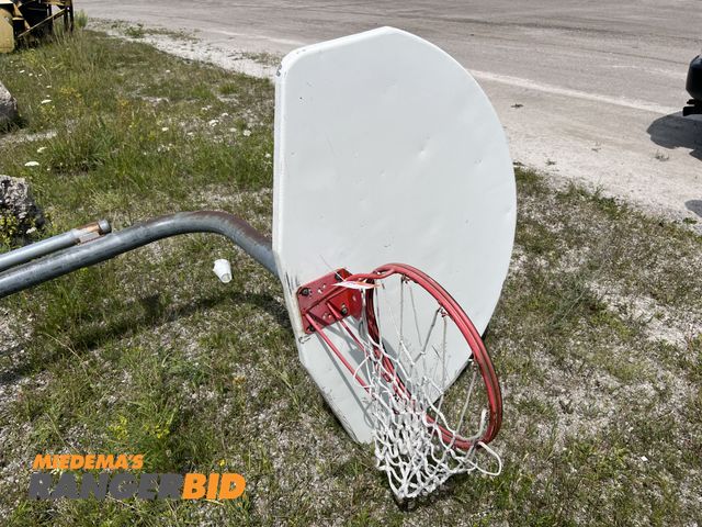 Lot 30-1167 - (1) 10' Basketball Hoop with Pole Metal, has concrete on the bottom.