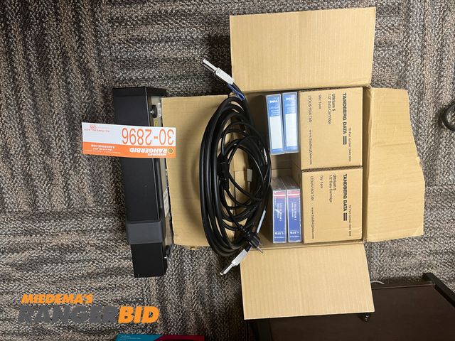 Lot 30-2896 - Dell CSEH 001 SAS External Tape Drive All the tapes shown are brand new and not opened. Cables come with it too.