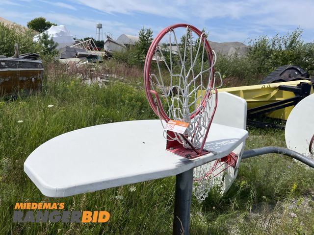 Lot 30-1166 - (1) 10' Basketball Hoop with Pole Metal, has concrete on the bottom.