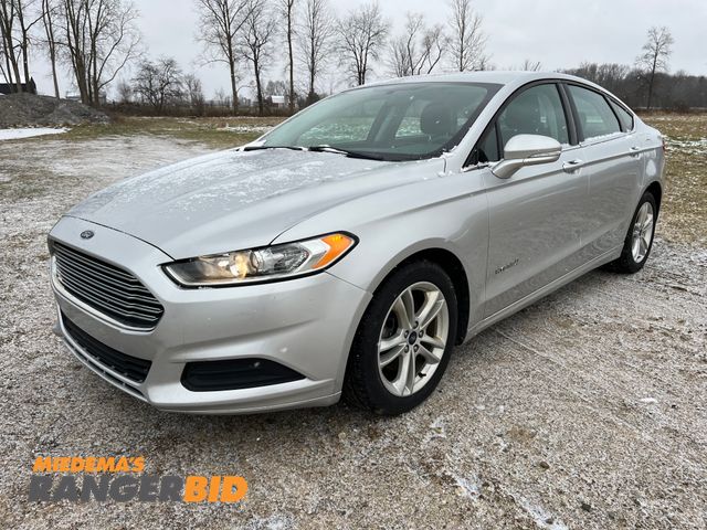 Lot 30-617 - 2014 Ford Fusion Hybrid with a 2.0L L4 DOHC 16V HYBRID engine. S with 76,933 miles Sedan Hybrid FWD