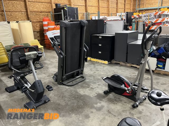 Lot 30-1927 - Lot includes treadmill, elliptical, and stationary bike.