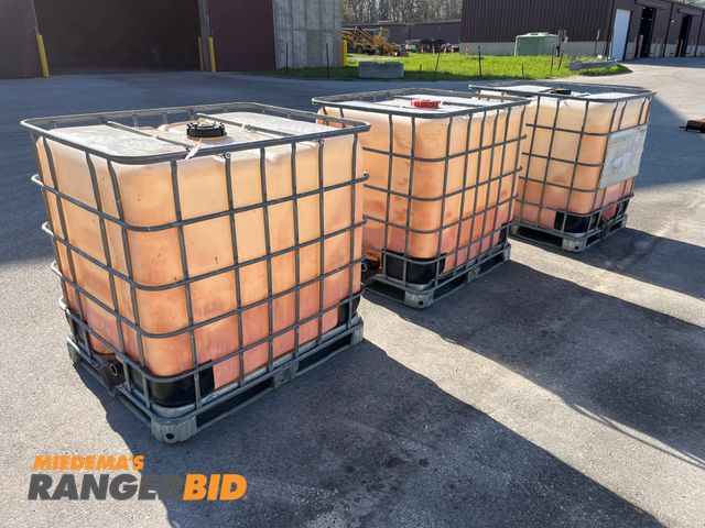 Lot 30-650 - 3 250 gallon totes with cage. Holds water