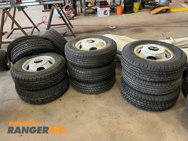 Lot 30-3406 - 11 Lot includes (11) new tires LT 225 / 75 R16 and (8) rims.