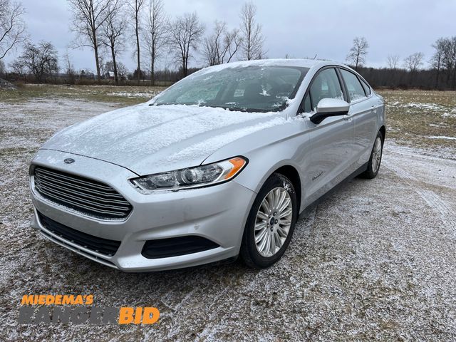 Lot 30-615 - 2014 Ford Fusion Hybrid with a 2.0L L4 DOHC 16V HYBRID engine. S with 74,293 miles Sedan Hybrid FWD